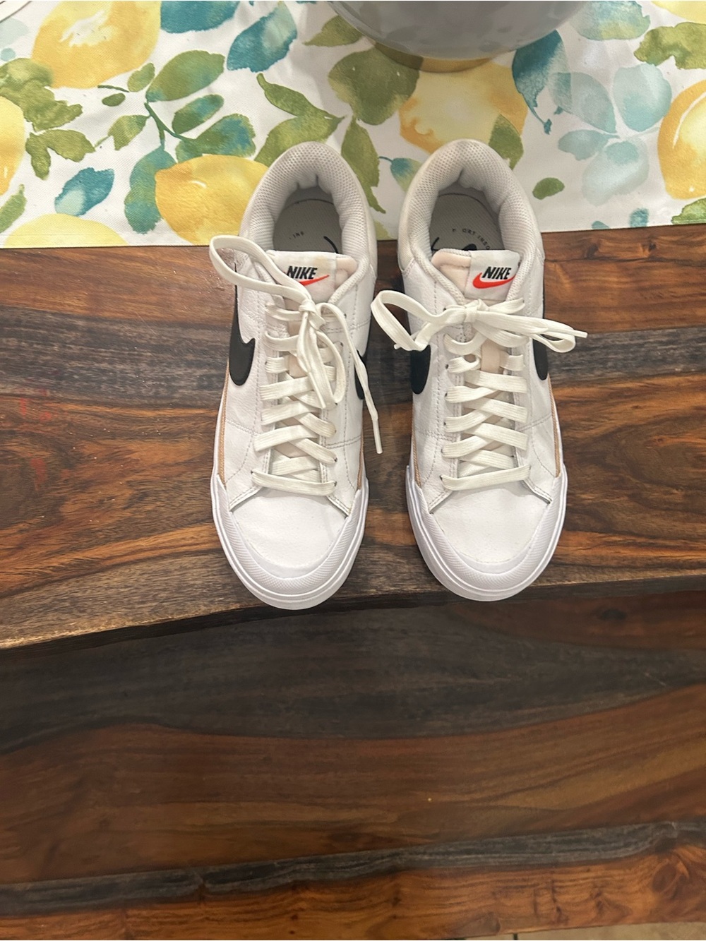 Nike White Low-Top Sneakers with Black Swoosh and Coral Accent